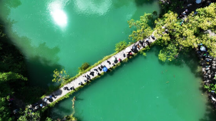 Visitors In Libo Countys Xiaoqikong Scenic Area In Guizhou Province
